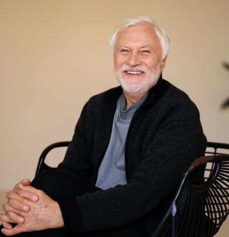 wise-senior-man-posing-studio-side-view